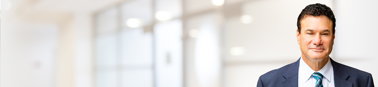 Hero Banner Image of Stephan T. Mashel over an unfocused office place, blur background